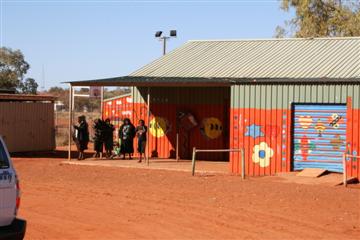 De Aboriginal nederzetting bij Uluru.